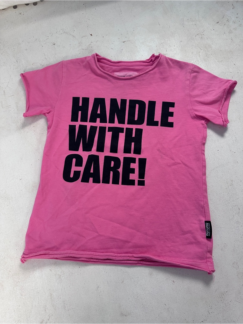 nununu Pink Short Sleeve Tee with Black 'HANDLE WITH CARE!' Graphic